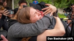 Return from captivity: tears, smiles, and endless hugs